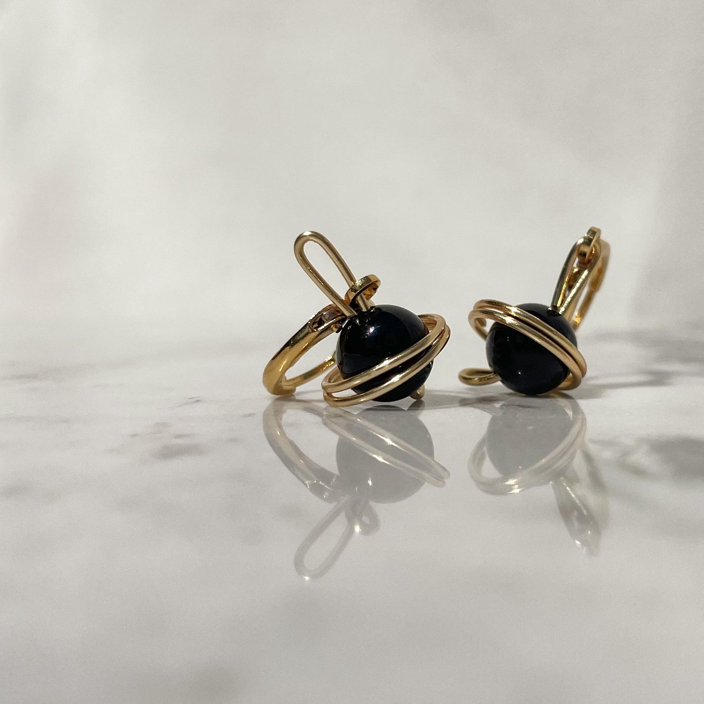 aretes Saturno cuarzo ónix artesanal México